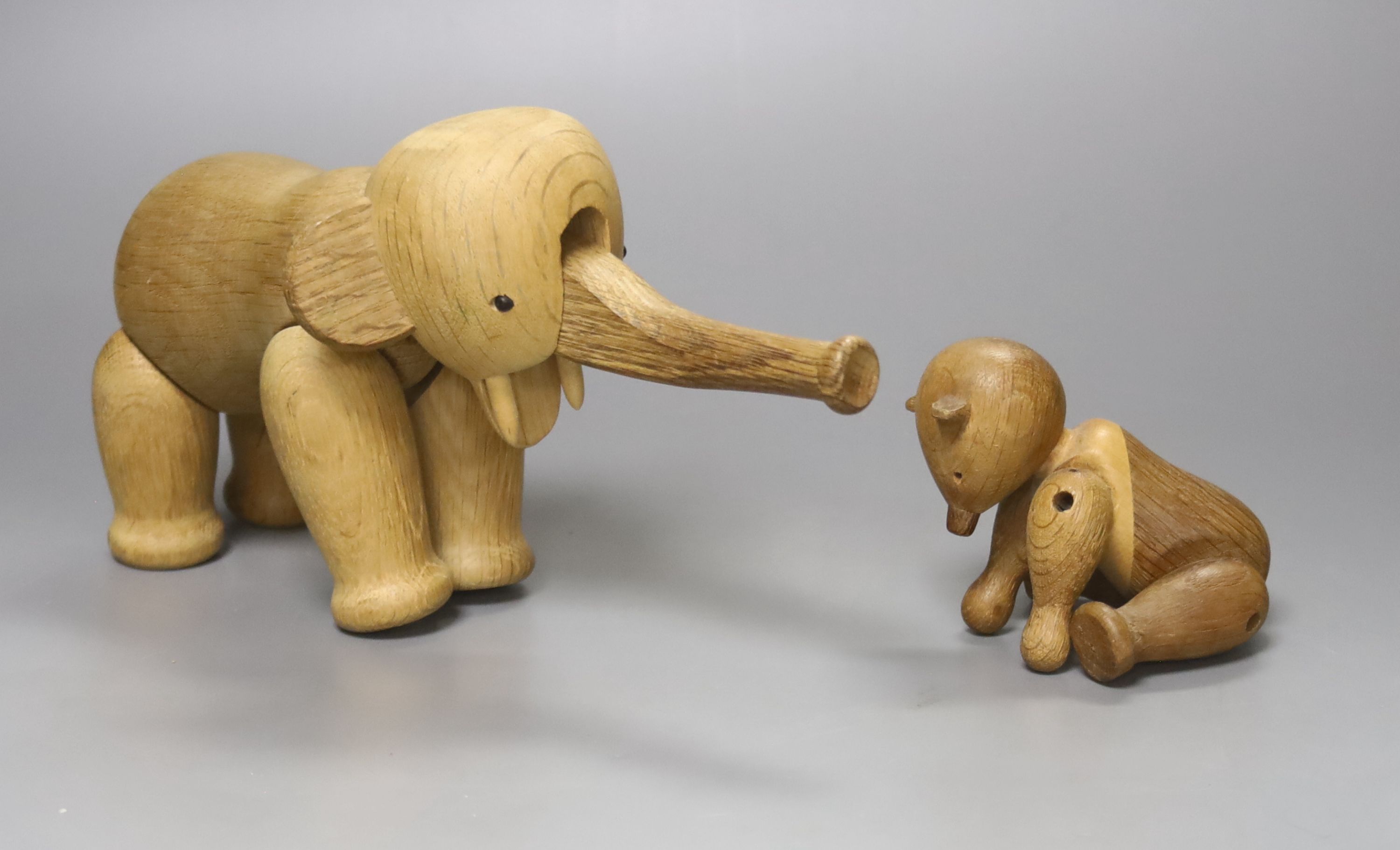 Two Danish carved wooden toys by Kay Bogesen, a standing elephant, 22cm length 14cm high and a seated bear, 10cm high